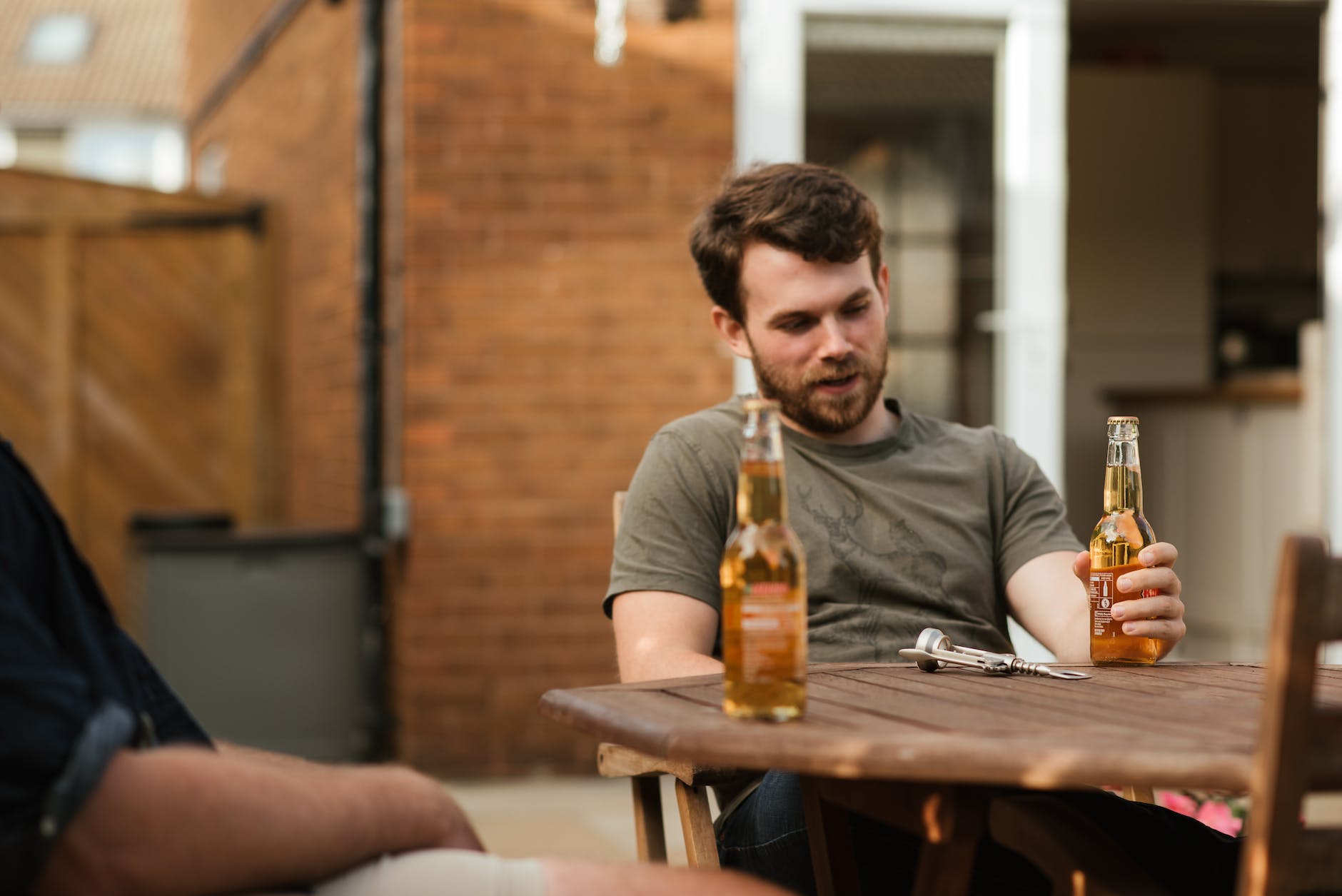 man consuming alcohol due to stress