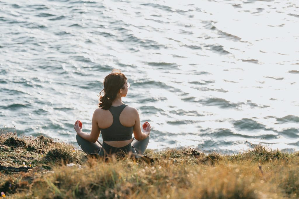 girl sitting by the water