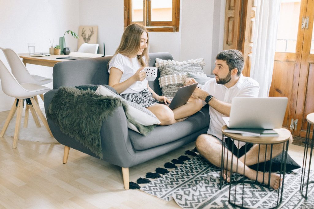 man and woman talking while working at the living room. a recipe for lasting marrige