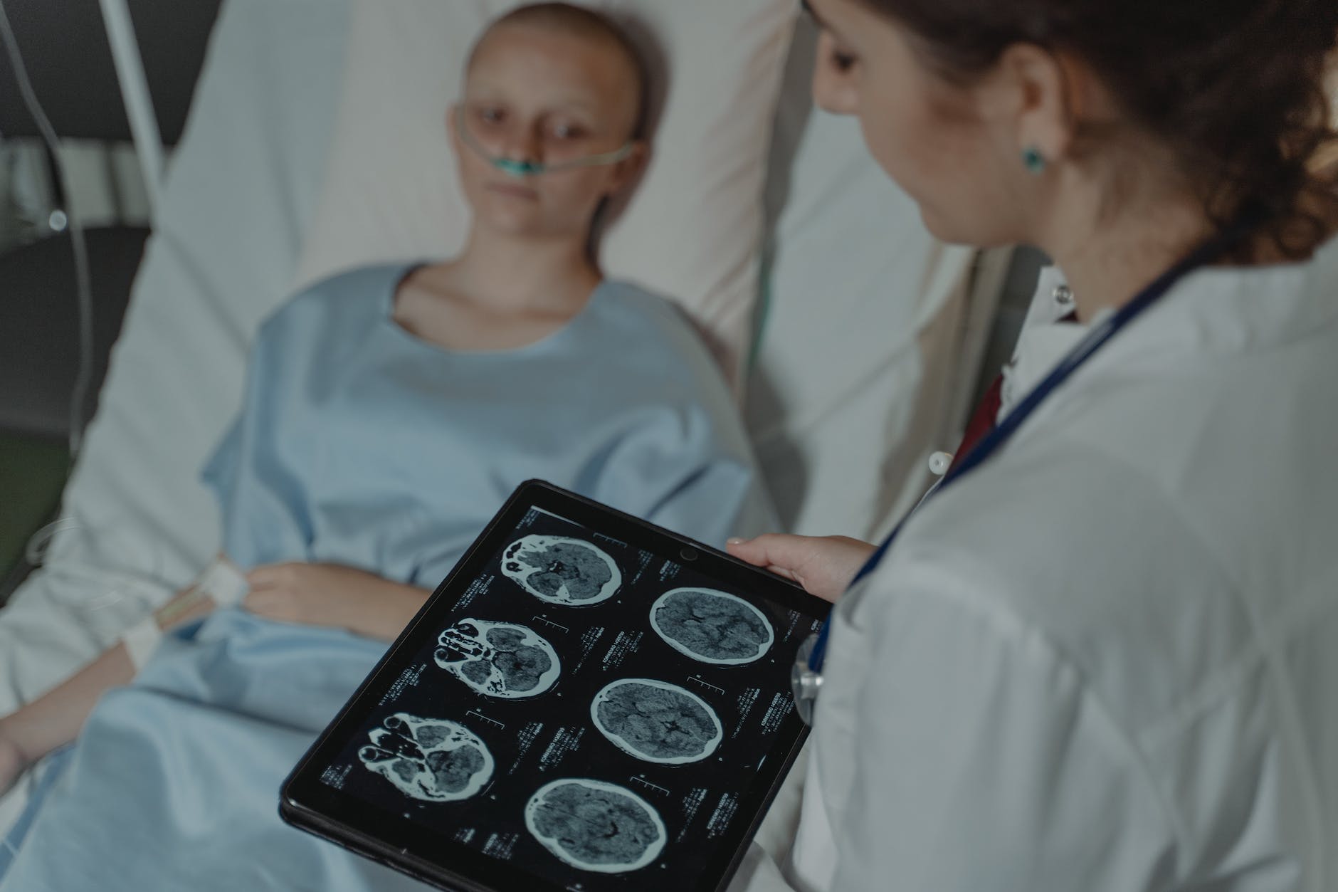 doctor looking at ct scan result of a brain tumor patient