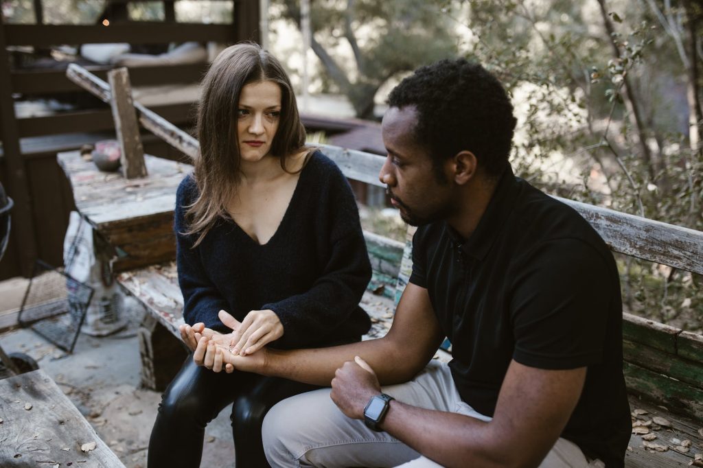 a woman giving the wedding ring to a man