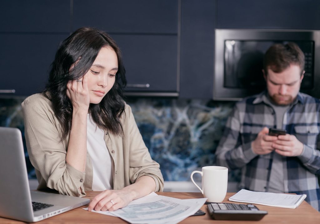 stressed woman looking at documents