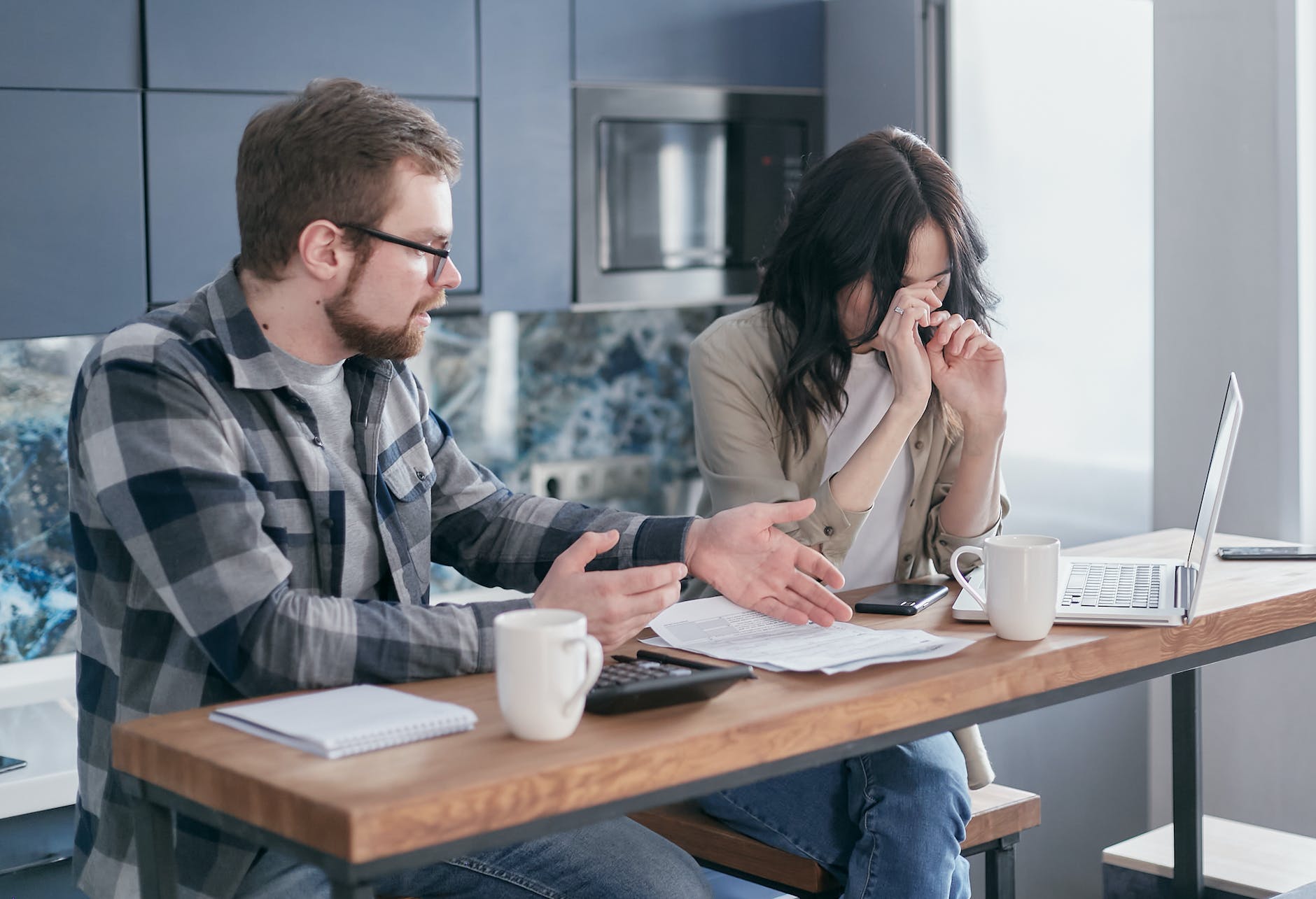 a couple having a conversation: woman is unhappy 