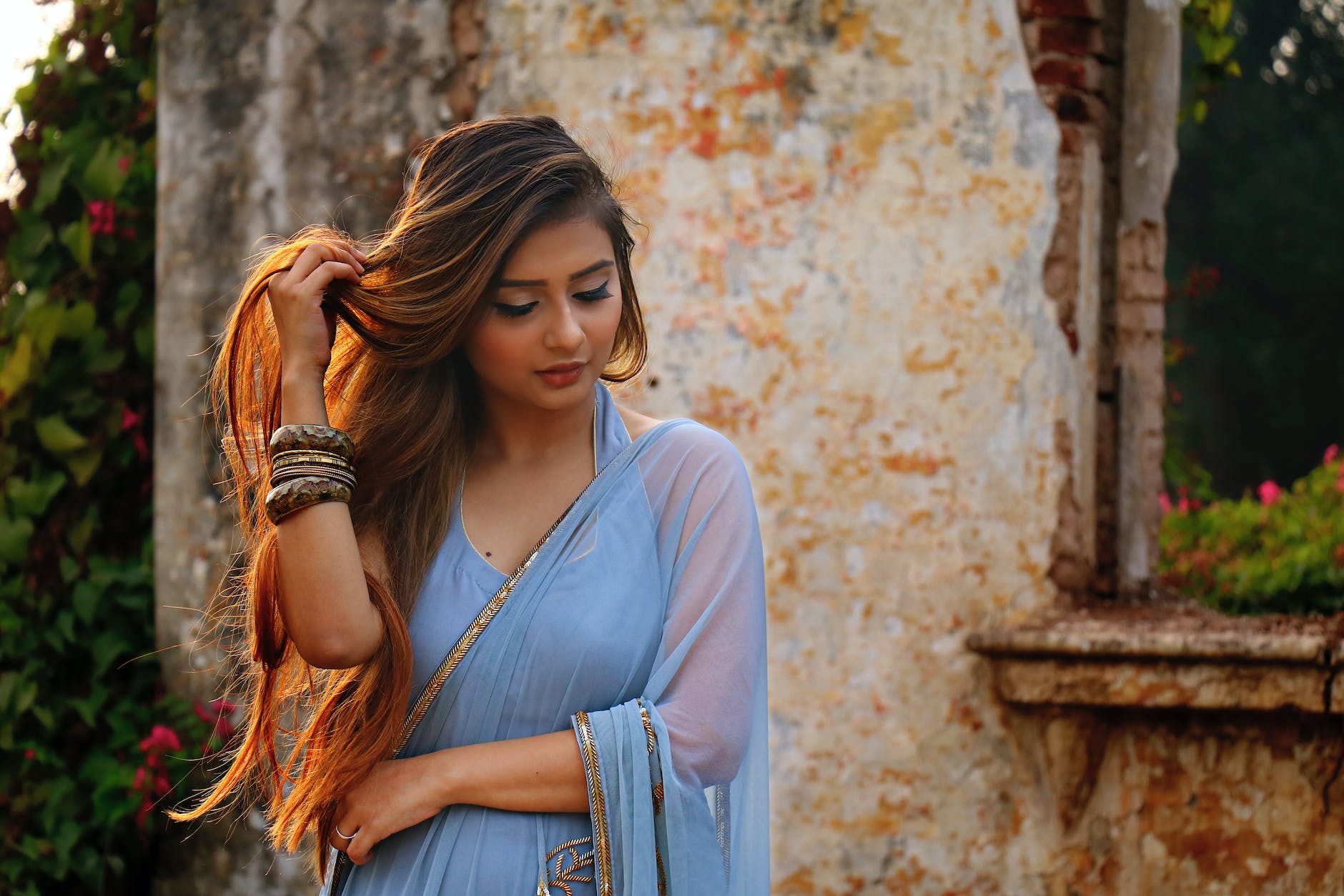 photo of woman wearing blue dress