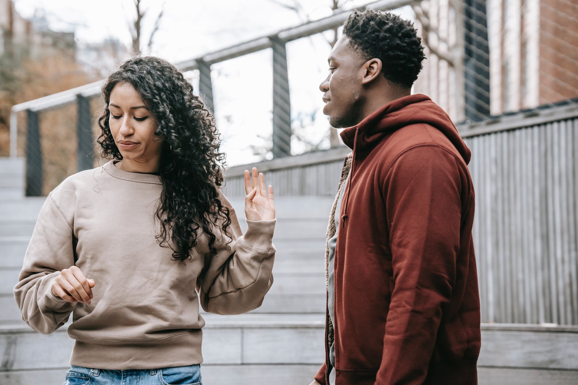 multiethnic couple arguing on street: Wasting Your Time in a Relationship