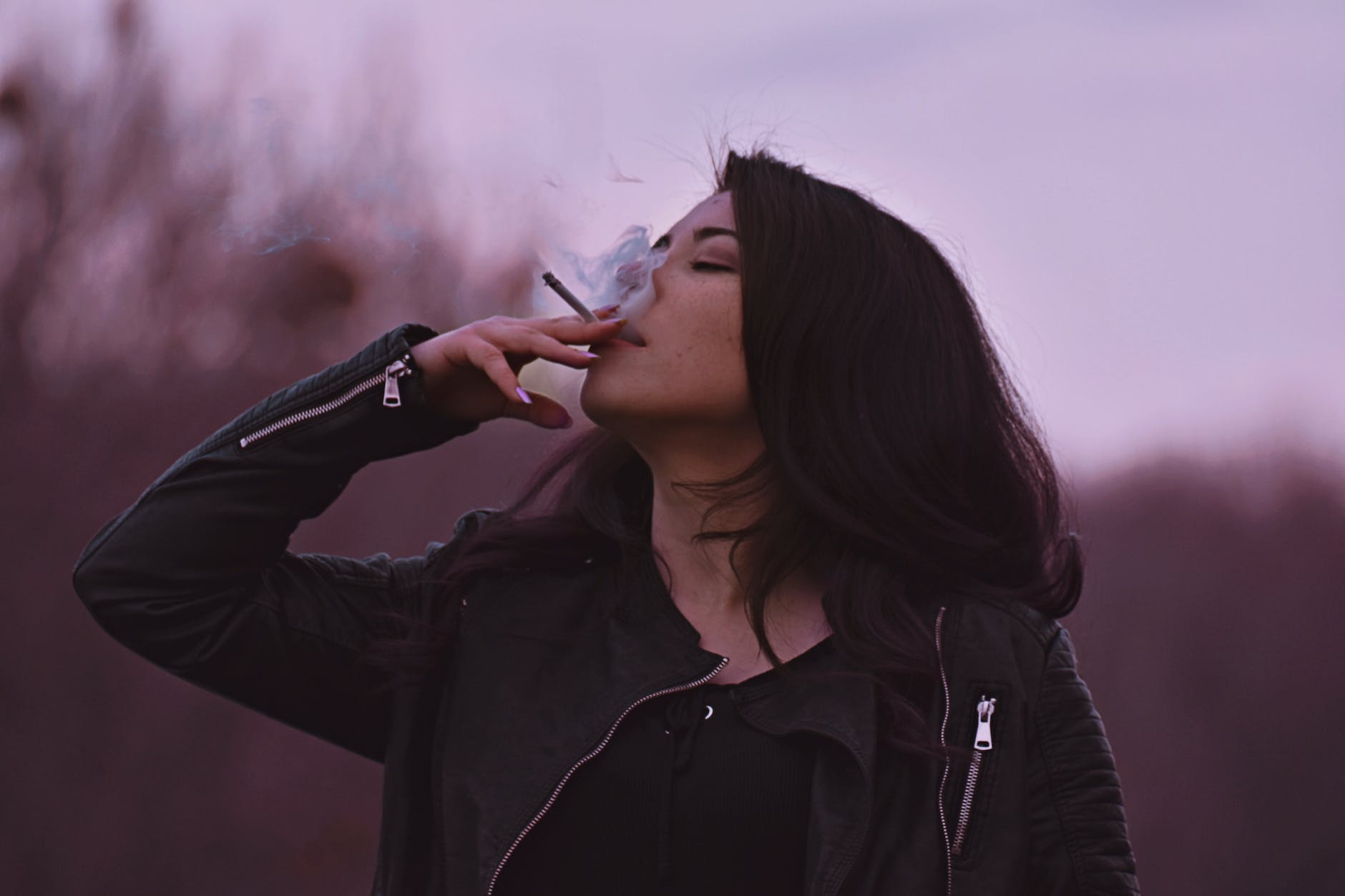 photo of woman smoking cigarette