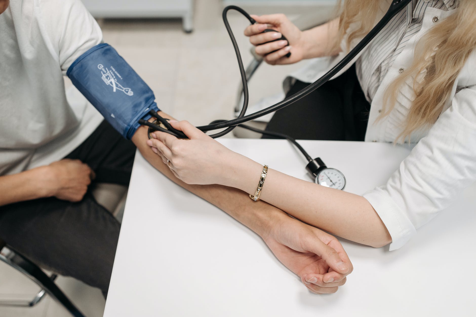 Healthcare worker using a sphygmomanometer blood pressure measurement 