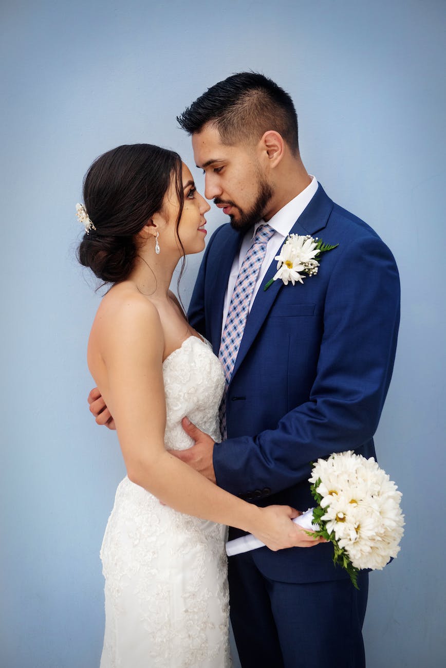 bride and groom standing next to each other