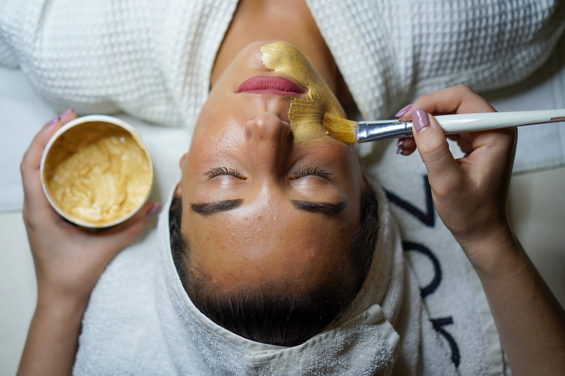 woman doing facial mask